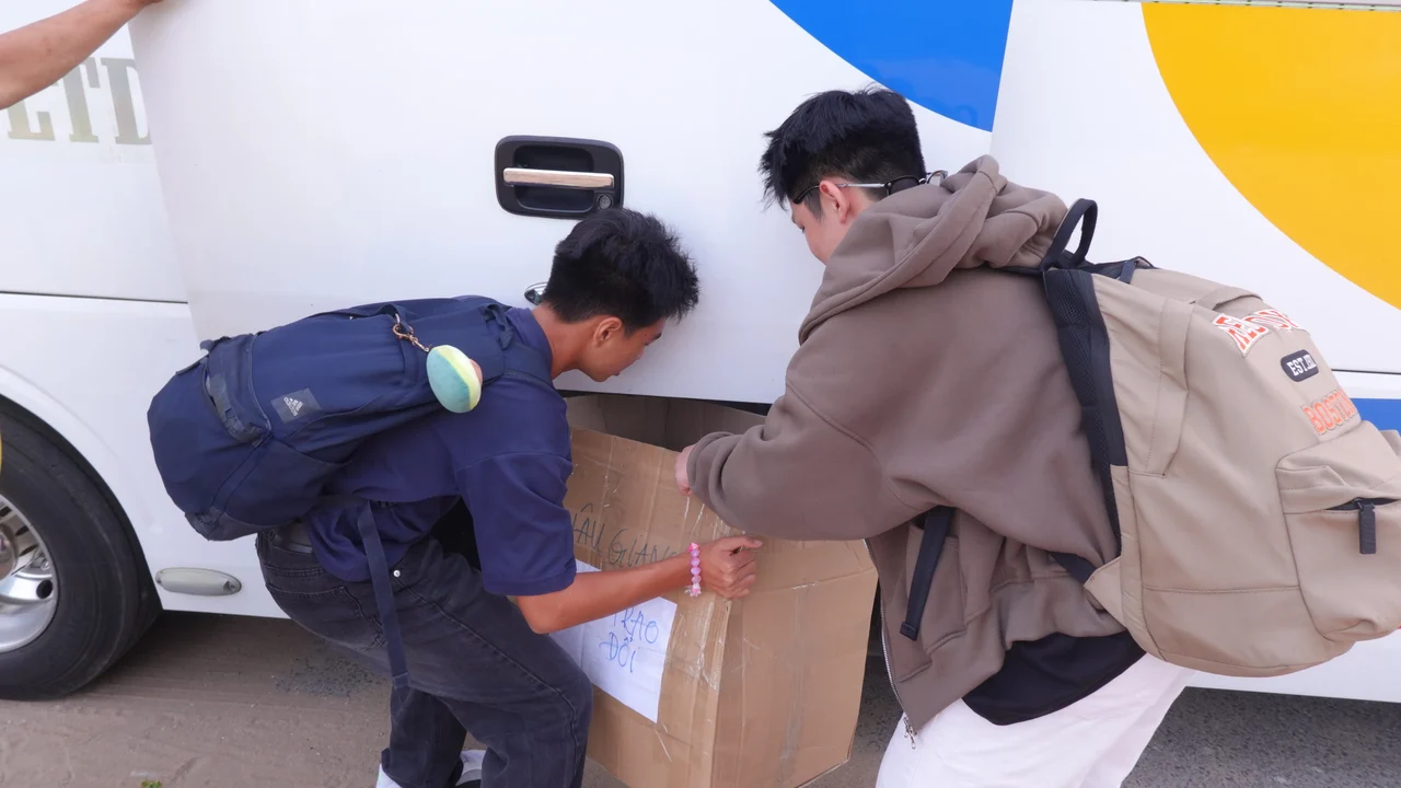 Volunteers carrying supplies for a community program